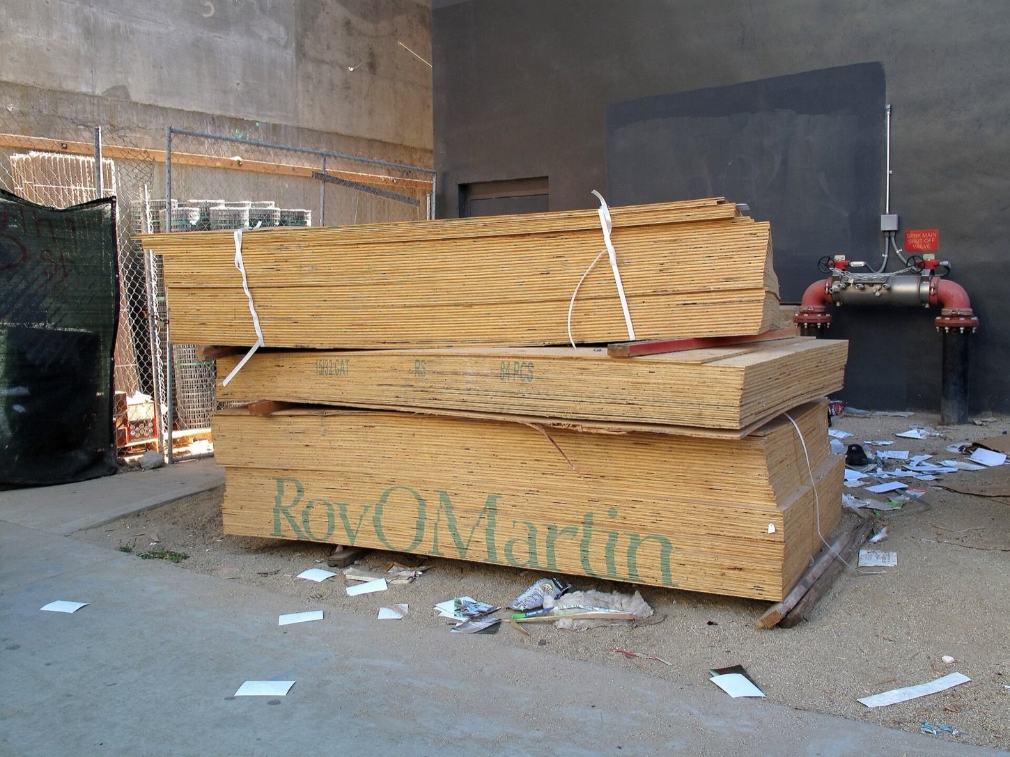 Neatly stacked plywood panels, illustrating the wood-related product range